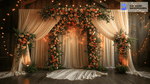 White Drape and Greenery Arch Zoom Background